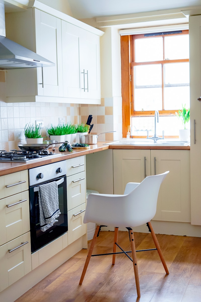 white chair near kitchen oven during daytime